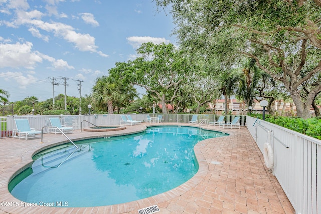 8700 Ridgewood Ave Unit Ph2B, Cape Canaveral, FL 32920 - community pool featuring a hot tub and a patio