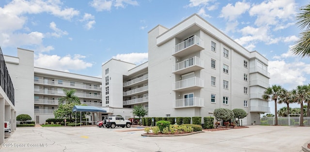 8700 Ridgewood Ave Unit Ph2B, Cape Canaveral, FL 32920 - view of apartment building / complex with uncovered parking