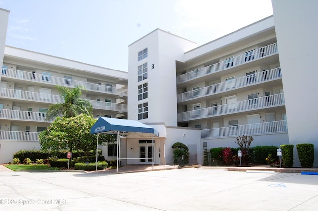 8700 Ridgewood Ave Unit Ph2B, Cape Canaveral, FL 32920 - view of apartment building / complex