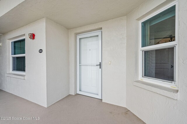 8700 Ridgewood Ave Unit Ph2B, Cape Canaveral, FL 32920 - property entrance featuring stucco siding