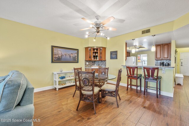 8700 Ridgewood Ave Unit Ph2B, Cape Canaveral, FL 32920 - dining area featuring ceiling fan and wood finished floors