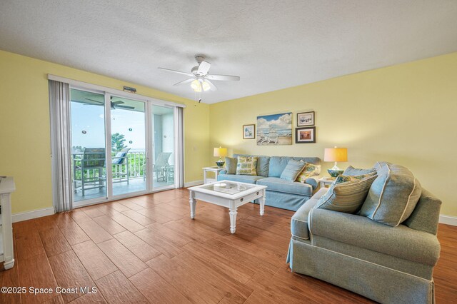 8700 Ridgewood Ave Unit Ph2B, Cape Canaveral, FL 32920 - living room with ceiling fan and wood finished floors