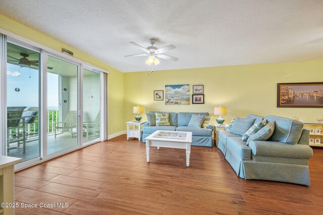 8700 Ridgewood Ave Unit Ph2B, Cape Canaveral, FL 32920 - living room with a ceiling fan and wood finished floors