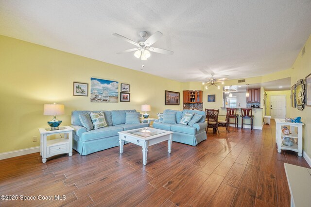 8700 Ridgewood Ave Unit Ph2B, Cape Canaveral, FL 32920 - living room with ceiling fan and dark wood-type flooring