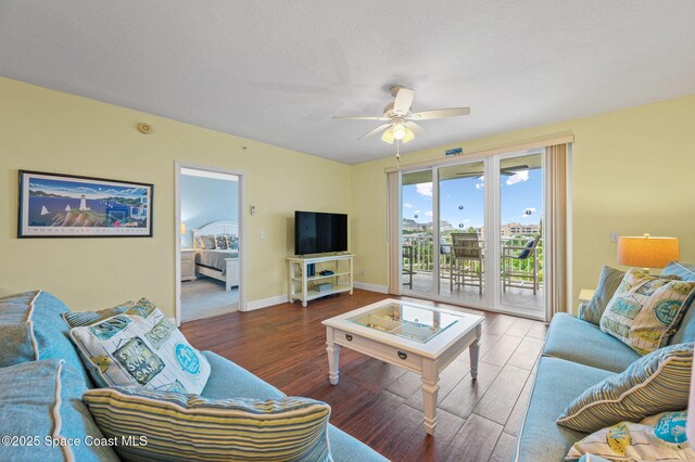 8700 Ridgewood Ave Unit Ph2B, Cape Canaveral, FL 32920 - living area featuring wood finished floors and ceiling fan