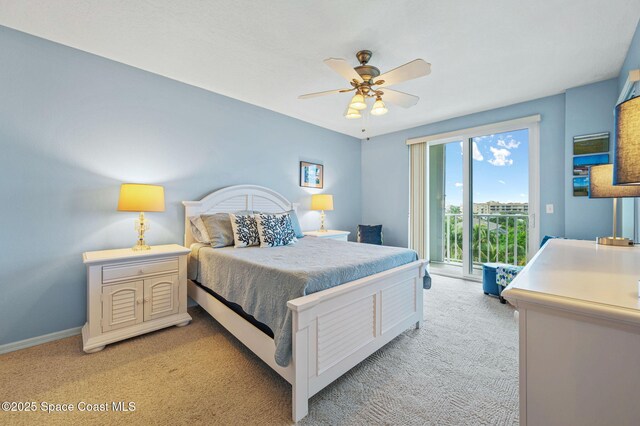 8700 Ridgewood Ave Unit Ph2B, Cape Canaveral, FL 32920 - bedroom featuring light carpet, access to exterior, and ceiling fan