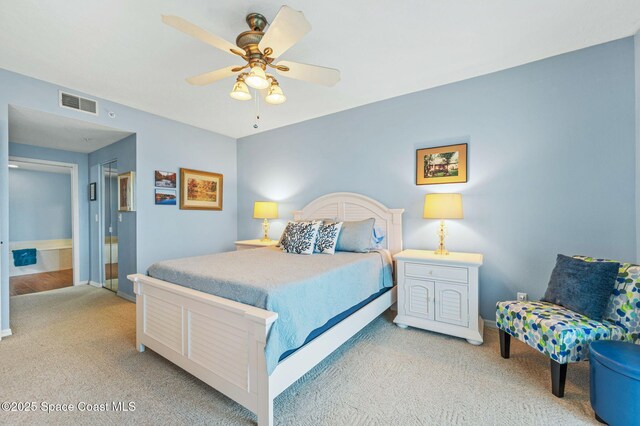 8700 Ridgewood Ave Unit Ph2B, Cape Canaveral, FL 32920 - bedroom with light colored carpet and a ceiling fan