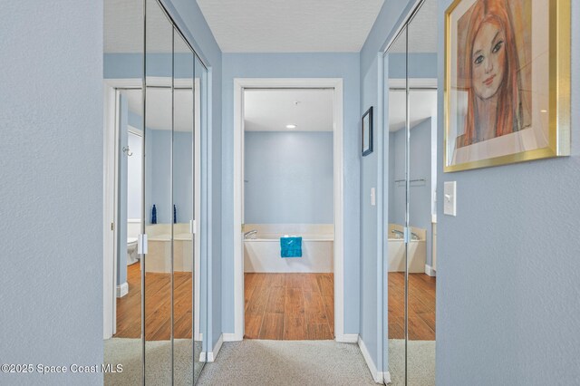 8700 Ridgewood Ave Unit Ph2B, Cape Canaveral, FL 32920 - hall with baseboards and carpet floors