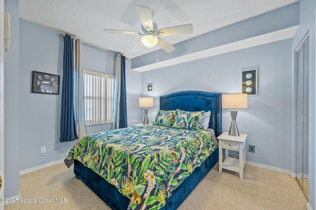 8700 Ridgewood Ave Unit Ph2B, Cape Canaveral, FL 32920 - carpeted bedroom with baseboards and ceiling fan