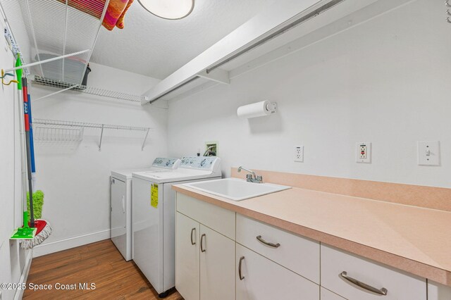 8700 Ridgewood Ave Unit Ph2B, Cape Canaveral, FL 32920 - washroom with independent washer and dryer and wood finished floors