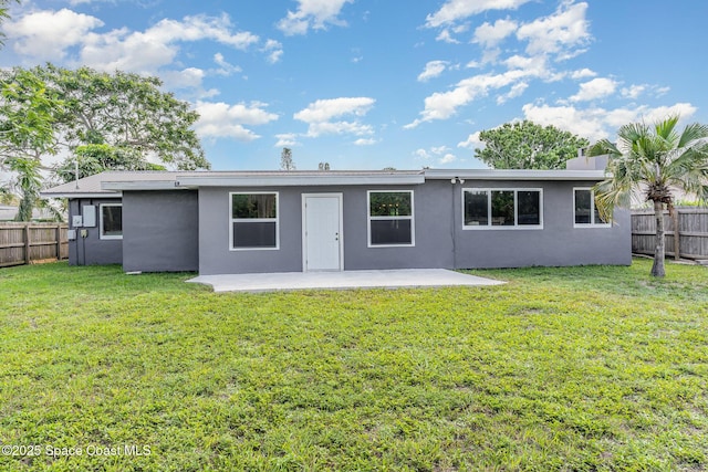 761 Bywood Dr NE, Palm Bay, FL 32905 - back of property with a patio, a fenced backyard, and stucco siding