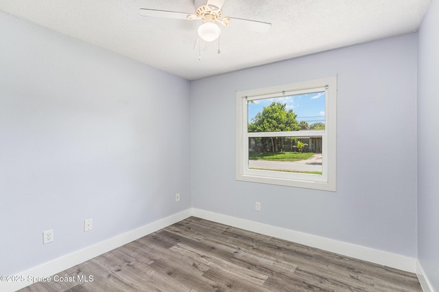 761 Bywood Dr NE, Palm Bay, FL 32905 - empty room with wood finished floors and a ceiling fan