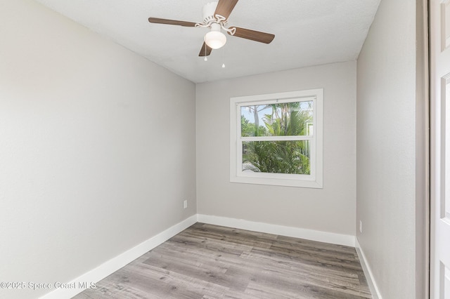 761 Bywood Dr NE, Palm Bay, FL 32905 - unfurnished room with wood finished floors and a ceiling fan