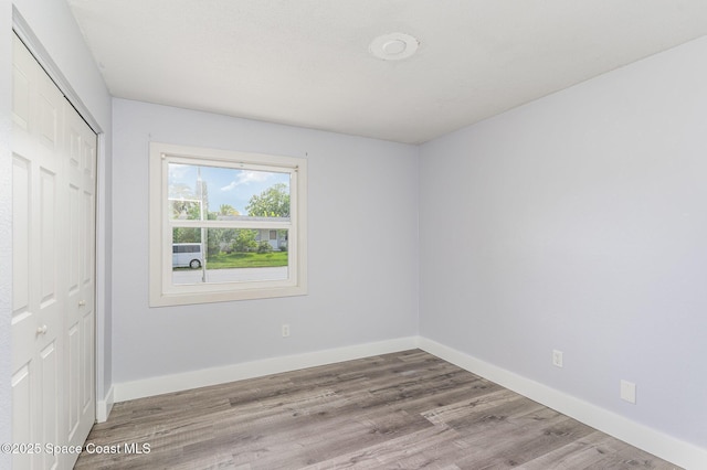 761 Bywood Dr NE, Palm Bay, FL 32905 - unfurnished bedroom featuring a closet and wood finished floors