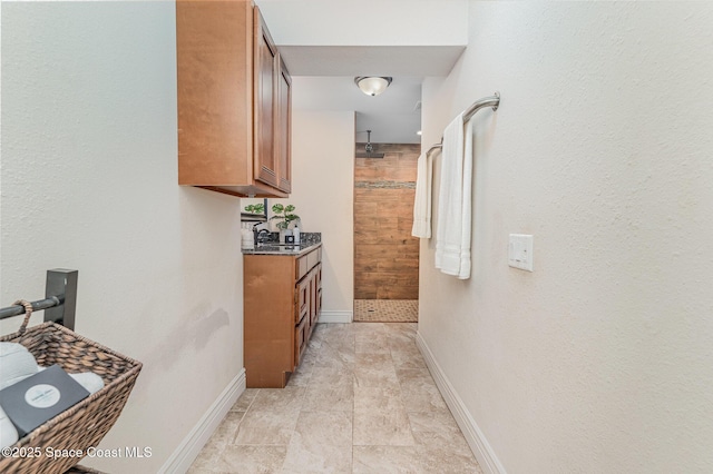 761 Bywood Dr NE, Palm Bay, FL 32905 - corridor with baseboards and a sink