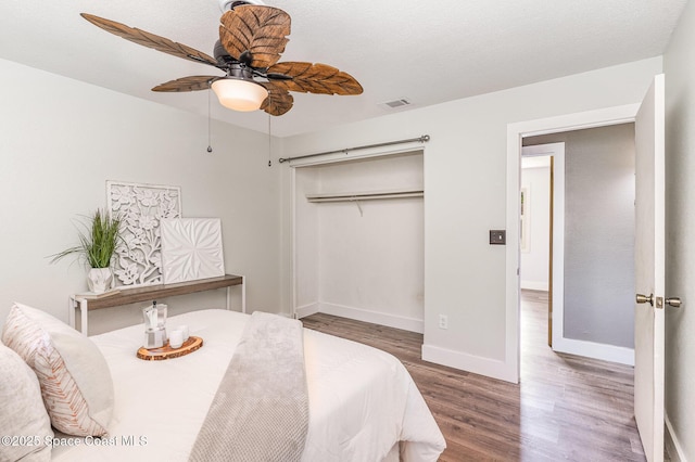 761 Bywood Dr NE, Palm Bay, FL 32905 - bedroom featuring wood finished floors, ceiling fan, and a closet