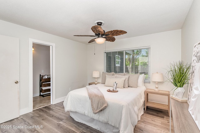 761 Bywood Dr NE, Palm Bay, FL 32905 - bedroom with wood finished floors and a ceiling fan