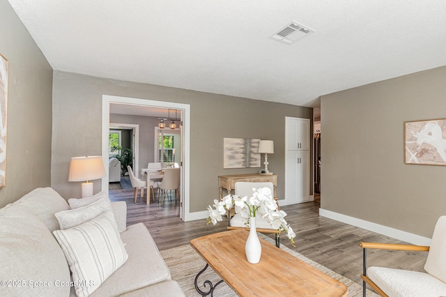 761 Bywood Dr NE, Palm Bay, FL 32905 - living area with a chandelier and wood finished floors