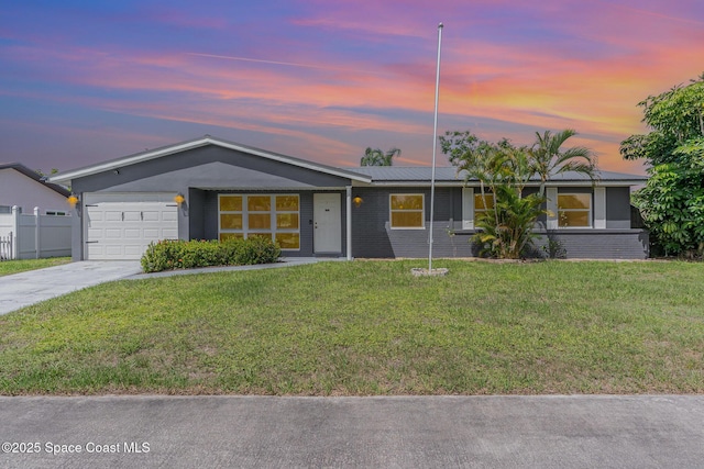 761 Bywood Dr NE, Palm Bay, FL 32905 - ranch-style house with concrete driveway, a garage, brick siding, and a lawn