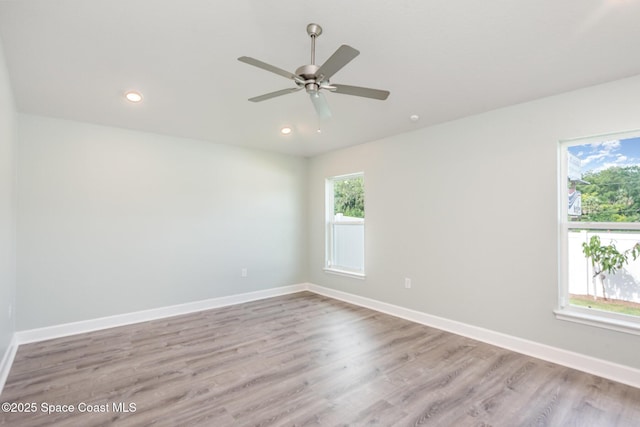 1331 Tupelo Cir, Cocoa, FL 32926 - unfurnished room with healthy amount of natural light, wood finished floors, a ceiling fan, and recessed lighting