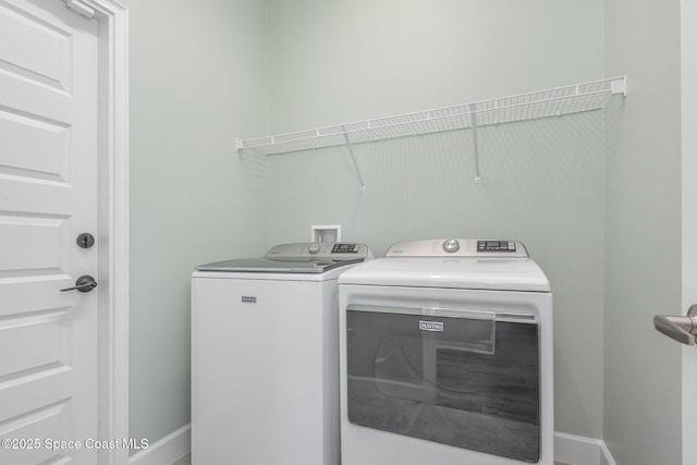 1331 Tupelo Cir, Cocoa, FL 32926 - laundry room featuring washing machine and clothes dryer and baseboards