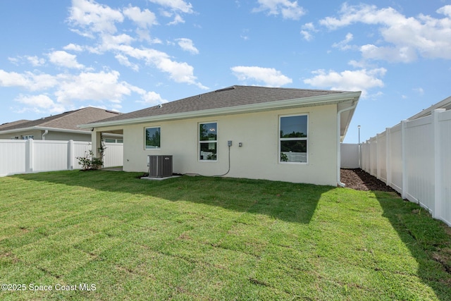 1331 Tupelo Cir, Cocoa, FL 32926 - back of property featuring central AC, stucco siding, and a shingled roof