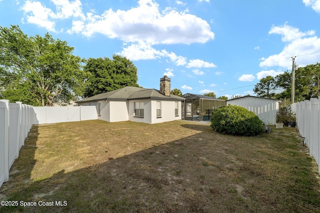 16190 SW 16th Ct, Ocala, FL 34473 - back of house featuring a chimney and a lanai