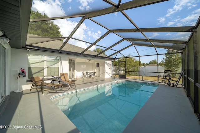 16190 SW 16th Ct, Ocala, FL 34473 - outdoor pool with a patio, glass enclosure, and outdoor dining space
