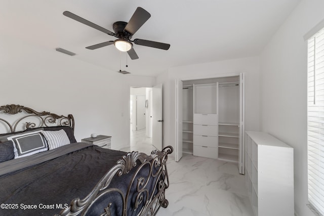 16190 SW 16th Ct, Ocala, FL 34473 - bedroom featuring light marble finish flooring, a ceiling fan, and a closet