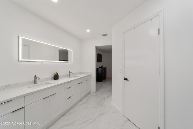16190 SW 16th Ct, Ocala, FL 34473 - bathroom featuring marble finish flooring, double vanity, and recessed lighting