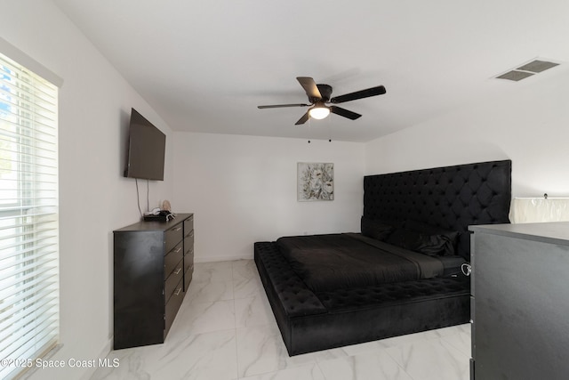 16190 SW 16th Ct, Ocala, FL 34473 - bedroom featuring light marble finish floors and a ceiling fan