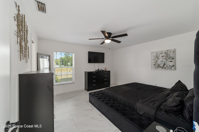 16190 SW 16th Ct, Ocala, FL 34473 - bedroom with light marble finish flooring and a ceiling fan