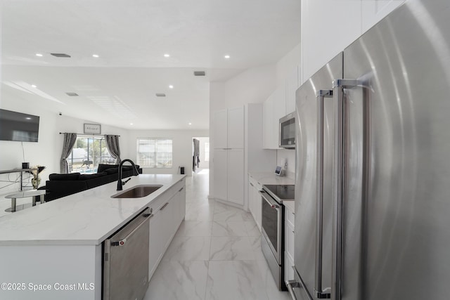 16190 SW 16th Ct, Ocala, FL 34473 - kitchen with appliances with stainless steel finishes, a sink, modern cabinets, light marble finish floors, and recessed lighting