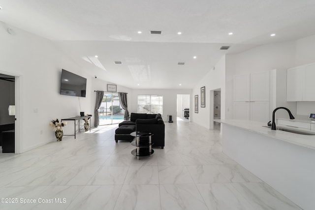 16190 SW 16th Ct, Ocala, FL 34473 - living area with vaulted ceiling, light marble finish floors, and recessed lighting