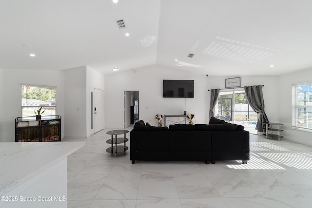 16190 SW 16th Ct, Ocala, FL 34473 - living room with lofted ceiling, light marble finish flooring, and recessed lighting