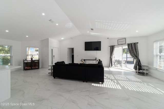 16190 SW 16th Ct, Ocala, FL 34473 - living room featuring plenty of natural light, light marble finish flooring, vaulted ceiling, and recessed lighting
