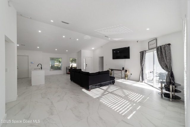 16190 SW 16th Ct, Ocala, FL 34473 - living area featuring lofted ceiling, recessed lighting, and light marble finish flooring