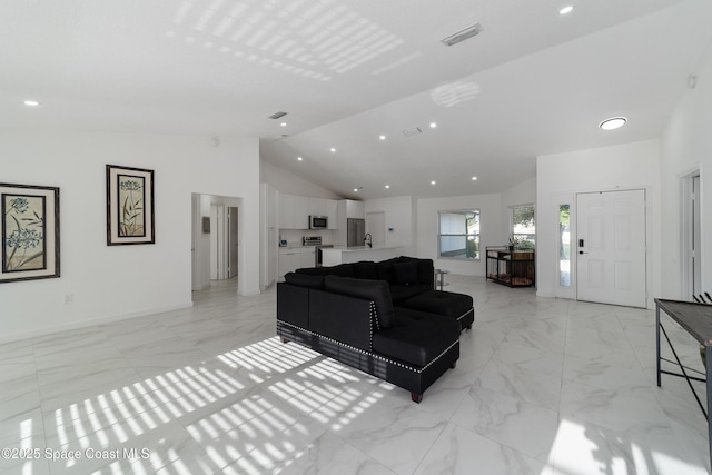 16190 SW 16th Ct, Ocala, FL 34473 - living area with light marble finish floors, high vaulted ceiling, baseboards, and recessed lighting
