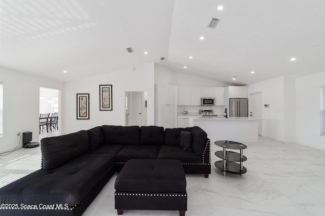 16190 SW 16th Ct, Ocala, FL 34473 - living room featuring lofted ceiling, light marble finish floors, and recessed lighting