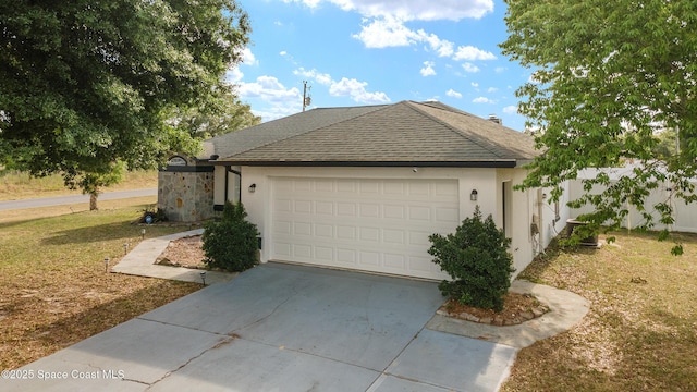 16190 SW 16th Ct, Ocala, FL 34473 - view of property exterior featuring stucco siding, concrete driveway, a shingled roof, an attached garage, and a yard