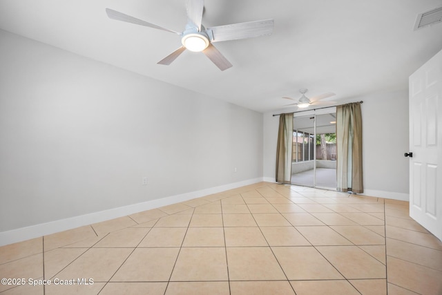 287 Edward Rd, Melbourne, FL 32904 - spare room with a ceiling fan, light tile patterned floors, and baseboards