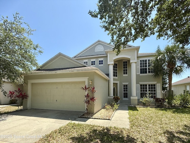 3687 Mount Carmel Ln, Melbourne, FL 32901 - view of front of home with stucco siding, a garage, and concrete driveway