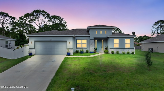 837 Wakaw Ln SW, Palm Bay, FL 32908 - prairie-style house with stone siding, a garage, concrete driveway, and stucco siding