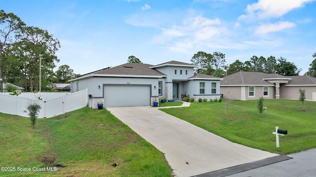 837 Wakaw Ln SW, Palm Bay, FL 32908 - prairie-style home with stucco siding, an attached garage, concrete driveway, a gate, and stone siding