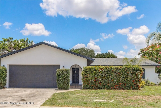 483 Sacre Coeur Dr, Melbourne, FL 32935 - single story home featuring stucco siding, an attached garage, concrete driveway, and a front yard