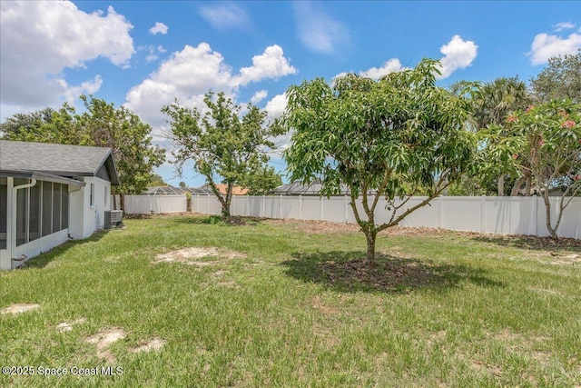 483 Sacre Coeur Dr, Melbourne, FL 32935 - view of yard with central AC unit and a sunroom