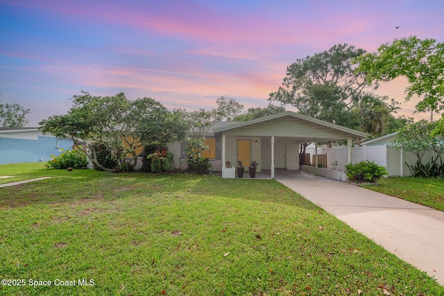 311 3rd St, Merritt Island, FL 32953 - ranch-style house featuring driveway and an attached carport