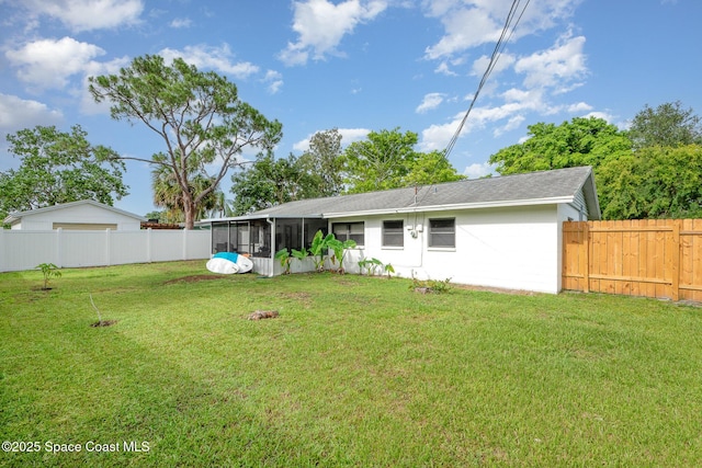 311 3rd St, Merritt Island, FL 32953 - rear view of property with a sunroom and roof with shingles