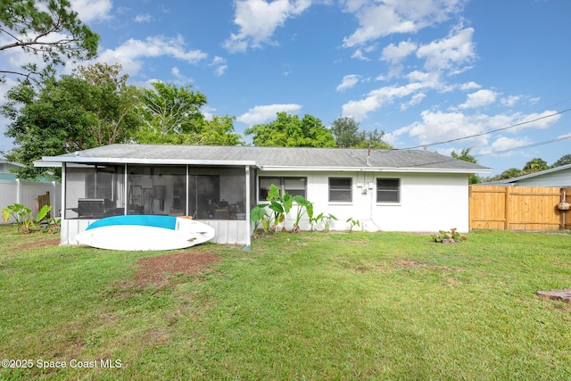 311 3rd St, Merritt Island, FL 32953 - rear view of house with a sunroom