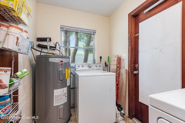 311 3rd St, Merritt Island, FL 32953 - washroom with washer / dryer and electric water heater